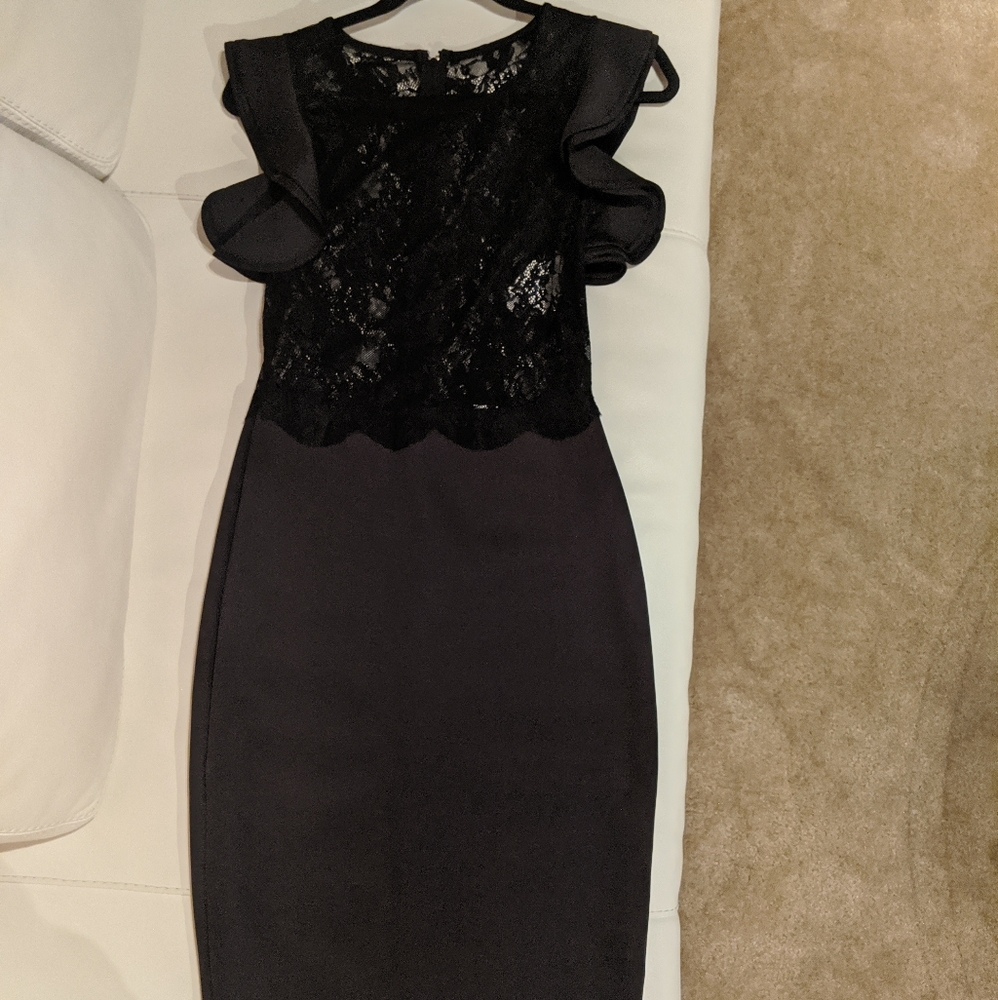 Black lace top dress with ruffle sleeves.